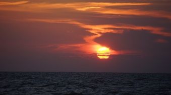 blazing sun at sunset over the sea