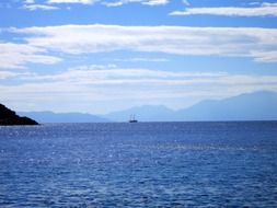 distant sailing ship on sea at sunset, turkey