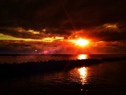 crimson sunset in the glow over the sea