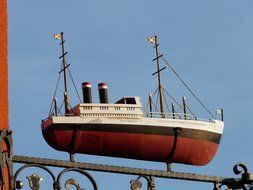 oldtimer cruise steamer, decoration on wrought iron fence