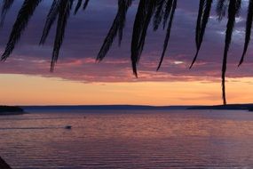 romantic sunset afterglow in sky above sea