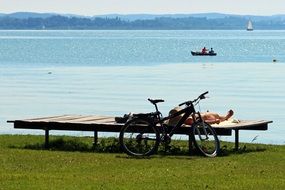 bike near the lounger on the lake