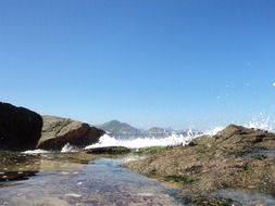 beach of paradise among the stones