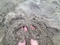 Feet in a sand