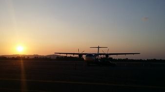 plane on sunset background in thailand