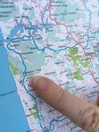 finger points to a place on the map