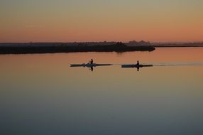 Two canoes on sea evening view