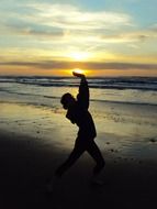 woman silhouette near ocean