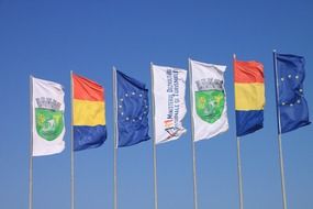 flags against blue sky