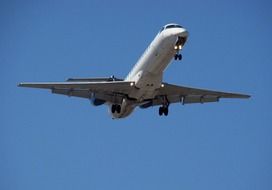 airplane flying in blue sky scene