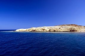 stone island in the blue sea