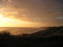 sunset afterglow over water in new zealand