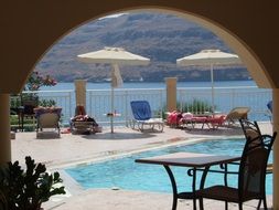 tourists on the loungers around the hotel pool