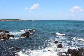 stones and waves on the coast of Jeju Island