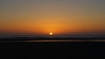 sun as a burning point on the horizon