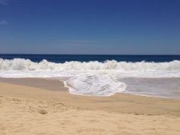 blue sky, white waves and yellow beach, mexico, cabo san lucas
