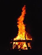 high bonfire in the dark