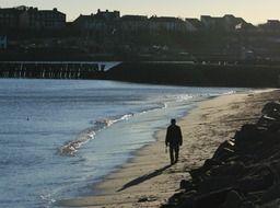 walk of a lonely person on the beach