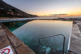 swimming pool at the sunset