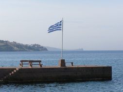 flag of greece on the coast