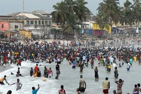 crowd of people resting on Beach, Ghana