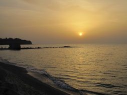 yellow setting sun over the coast of Calabria