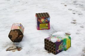 fireworks boxes lying on snow