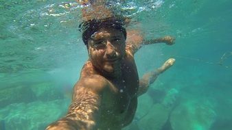 tourist is photographed by the water
