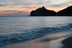 landscape of sea waves and sandy beach