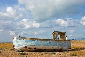 abandoned fishing boat on the shore