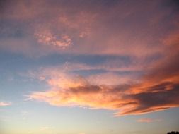 orange clouds at sunset in the blue sky