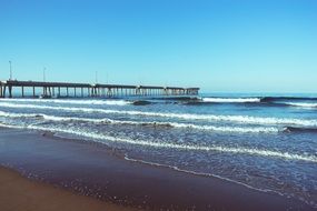 remote view of the pier on the picturesque coast