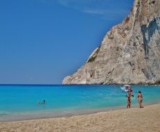 people on the beach on the island of Zakynthos, Greece