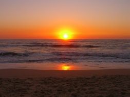 Distant view of the sunset in the ocean of Portugal