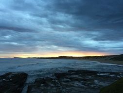 Landscape of Evening sky over the rocky beach