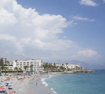clouds over the beach and buildings