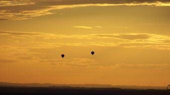 two balloons at an incredibly beautiful sunset