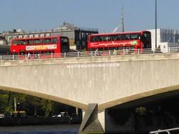 red buses on Waterloo bridge in London