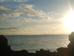 bright sun on the horizon over the ocean