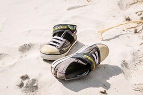 old sneakers on the beach