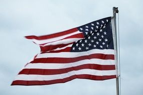 american flag waving in the sky