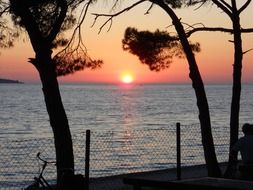 red sunset above blue sea, croatia