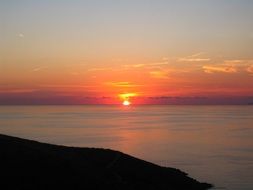 sun at sunset on the horizon of the sea