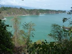 scenic bay at rocky coast, costa rica, manuel antonio