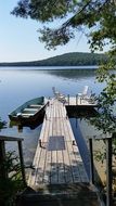 wooden pier on the lake in the village