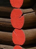 wood beams painted in red closeup