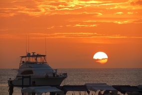 yacht near the coast at sunset