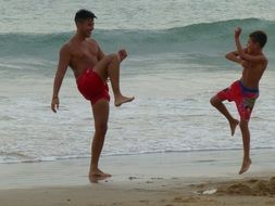 happy brothers on the beach