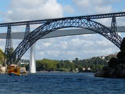 arched iron bridge over the river Douro
