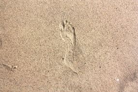 footprints in the beach